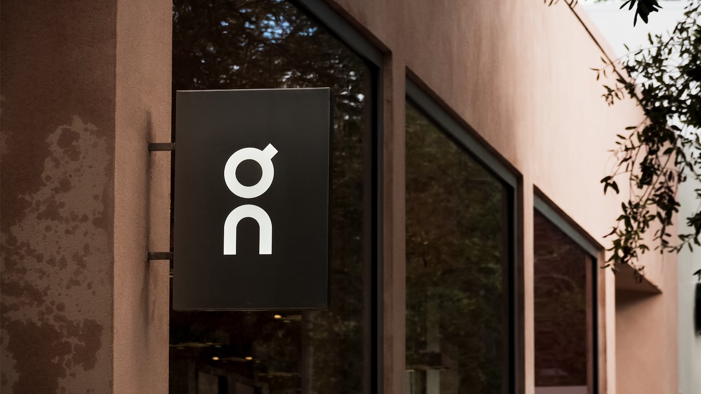 A sign for On Running's brick-and-mortar store.