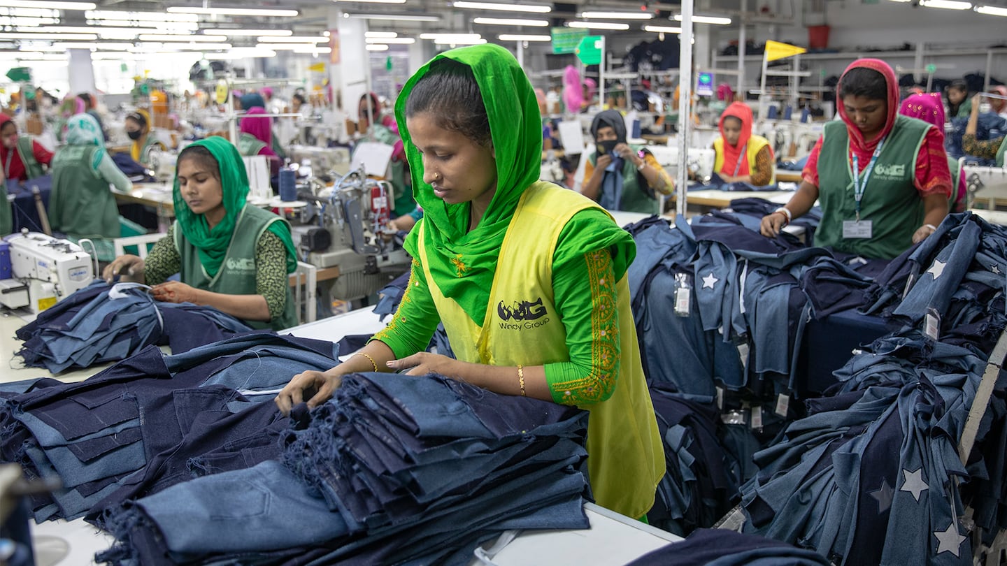 Garment workers sewing items in a factory in Tongi, Bangladesh, on July 6, 2025.